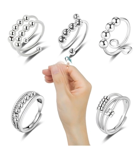 Close-up of spinning silver beads on anti-anxiety rings for stress relief and fidgeting