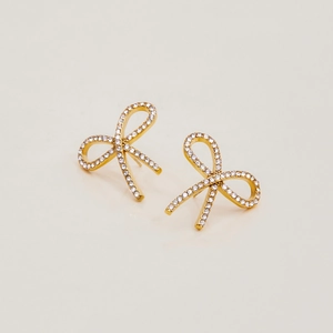 Close-up of 18K gold stainless steel bow earrings with sparkling pave-set rhinestones