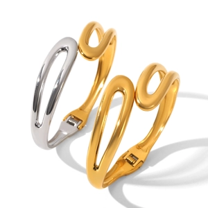 Polished gold and silver stainless steel open bangle featuring fluid hollow design
