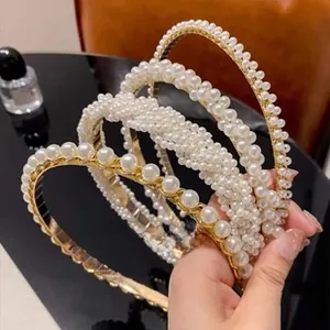 Detailed set of four gold alloy headbands featuring elegant faux white pearls and beads