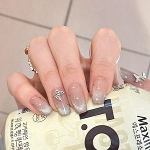 Cat eye press-on nails with 3D silver butterflies and gold polka dots on gradient purple