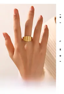 Macro shot of 18k gold plated Tree of Life ring with honeycomb texture details