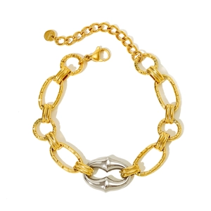 Detail of gold and silver chunky chain bracelet with industrial interlocking link