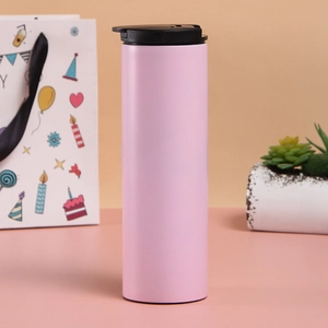Detailed macro view of pink matte stainless steel vacuum cup with black leak-proof lid