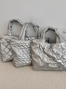 Modern silver metallic tote bags featuring quilted wave and bow patterns in three styles