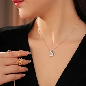 Star-shaped zircon pendant necklace in gold and silver finish on elegant model
