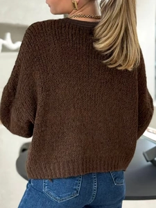 Loose dark brown knit cardigan for women with thick texture shown from a back view
