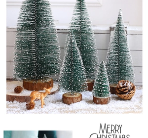 Mini knitted Christmas trees with reindeer and pine cones on a wooden base
