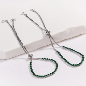 Detailed view of adjustable box chain necklace with vibrant emerald green zircon stones