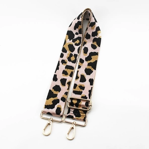Adjustable leopard print bag strap with pink base and gold-tone lobster clasps