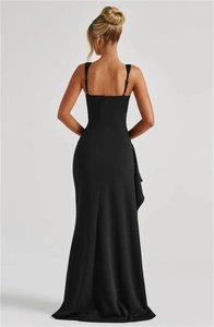 Detailed back view of a slim-fit black evening dress featuring thin straps and backless design
