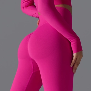 Detail of hot pink seamless ribbed yoga leggings featuring a flattering scrunch butt lift