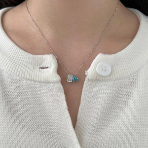 S925 sterling silver necklace featuring radiant heart-shaped blue carbon diamond on a model