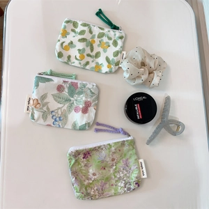 Three-piece floral cotton mini coin purses with zipper in various botanical patterns