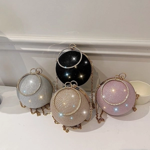 Sparkly spherical evening bags in black silver gold and purple with metal ring handles