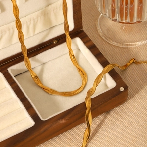 18K gold-plated stainless steel snake chain necklace displayed in a wooden jewelry box