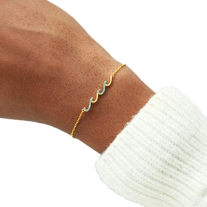 Adjustable wavy gold chain bracelet with sky blue diamonds for women minimalist style
