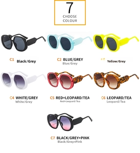 Collection of seven oversized colorful sunglasses with thick frames and diverse lenses