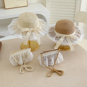 Summer straw hat and bag set for kids with lace bow accents in beige and brown colors