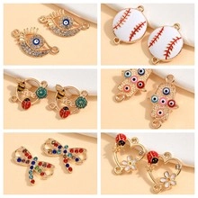 Macro detail of alloy pendants with enamel and rhinestones for DIY jewelry making