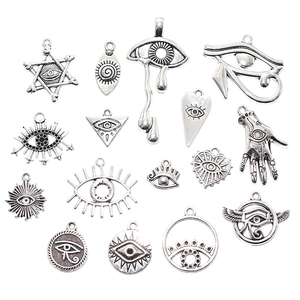 Retro silver alloy Eye of Horus charms for DIY necklace making on white background