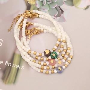 White shell pearl bracelet with golden beads and colorful natural stone hexagonal charms