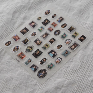Detail of 5D embossed nail stickers featuring vintage art portraits and stamp designs