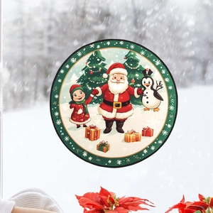 Close-up of circular Santa Claus window sticker with a young girl and penguin illustration