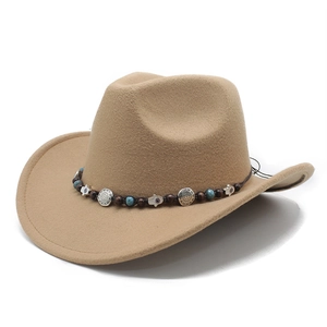 Detail of khaki cowboy hat with ethnic turquoise beads and Fatima hand charms