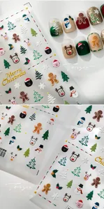 Detailed 3D embossed Christmas nail stickers featuring snowmen, gingerbread and reindeer