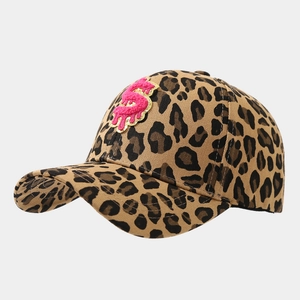 Close-up of leopard print baseball cap with pink melting dollar sign embroidery patch