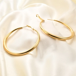 Chic 6mm gold-tone oval hoop earrings on elegant white silk fabric for daily party wear