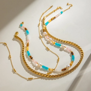 Layered 18k gold stainless steel necklace featuring colorful natural stone beads and pearls