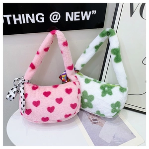 Detail of plush shoulder bags with heart and floral patterns plus silk scarf handles