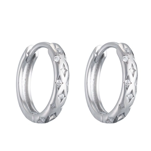 Star-shaped silver earrings with micro-paved cubic zirconia crystals in a sleek finish