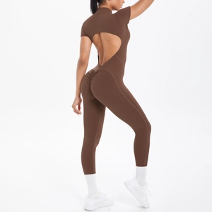 Detail of coffee brown short sleeve fitness bodysuit showing back cutout and ruched butt lift