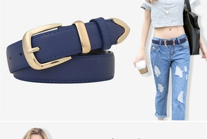 Detail of blue litchi pattern leather belt with a luxury gold alloy buckle on model