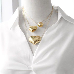 Three-layer gold puffy heart pendant necklace set with polished metal beads for women