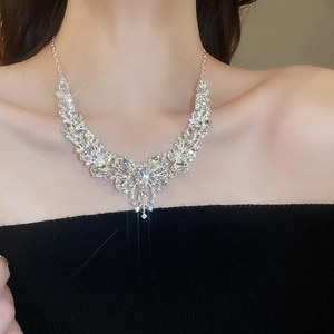 Detailed view of luxury silver-tone rhinestone necklace with elegant petal-shaped pattern