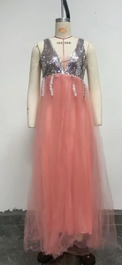 Detail of silver sequins and pink tulle layers on a deep V-neck sleeveless evening gown
