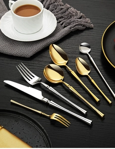 Detailed macro view of 304 stainless steel cutlery set in gold and silver mirror finish