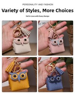 Detailed close-up of colorful leather owl keychains with tassels and gold lobster clasps