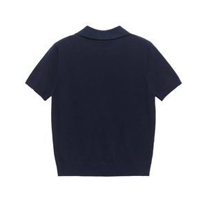Detail view showing the knit texture and ribbed hem of the navy blue short sleeve polo sweater