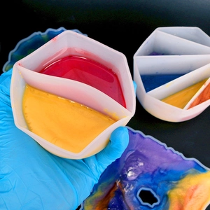 Close-up of flexible silicone mixing cups for resin art with multiple compartments