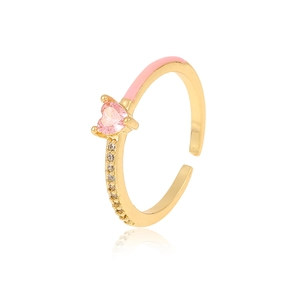 Detail of gold-plated ring with pink heart zircon, enamel trim, and sparkling accents