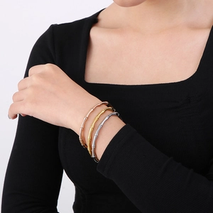 Three-piece bamboo joint bangle set in gold, silver, and rose gold stainless steel