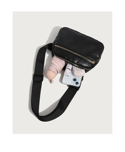 Top view of black textured PU leather cross-body bag showing spacious interior compartment