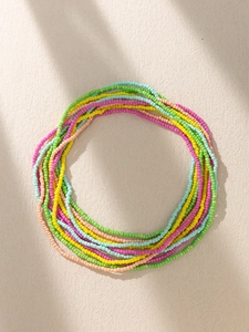 Detail of bohemian colorful seed bead waist chain showing multi-layered texture and craft