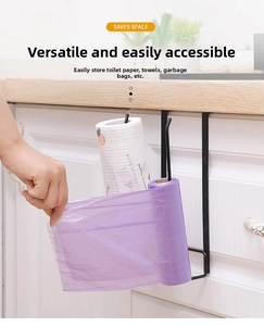 Detail view of black metal hanging rack for kitchen paper and wrap rolls on a cabinet shelf