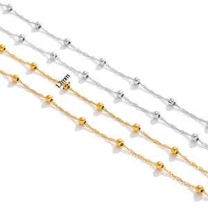 Detailed close-up of 1.7mm gold and silver beaded twist chains for DIY jewelry making